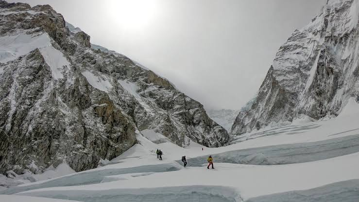 Collapsed Himalayan glacier above a flooded mountain valley in the Nepal-Tibet region